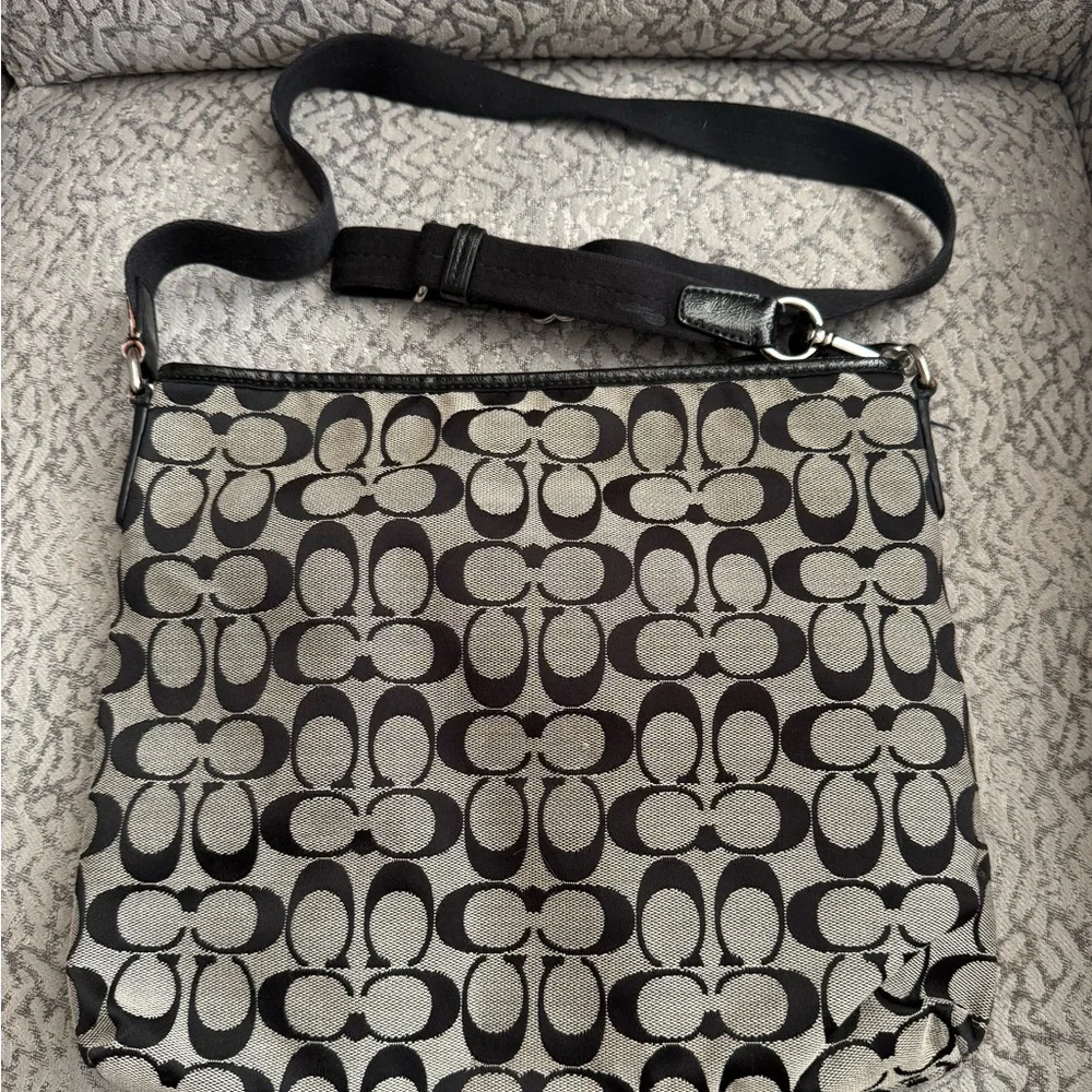 Coach Signature Stripe File Bag features a black and gray monogram canvas